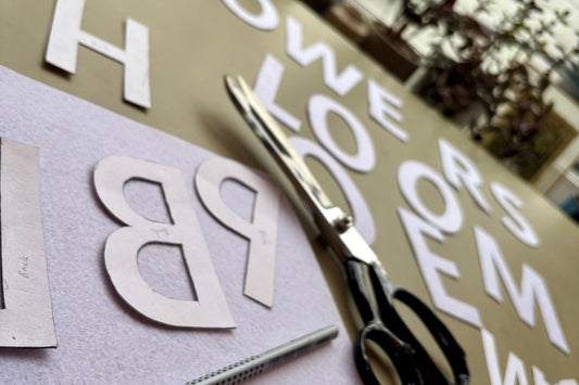 Hand cut felt letters and scissors