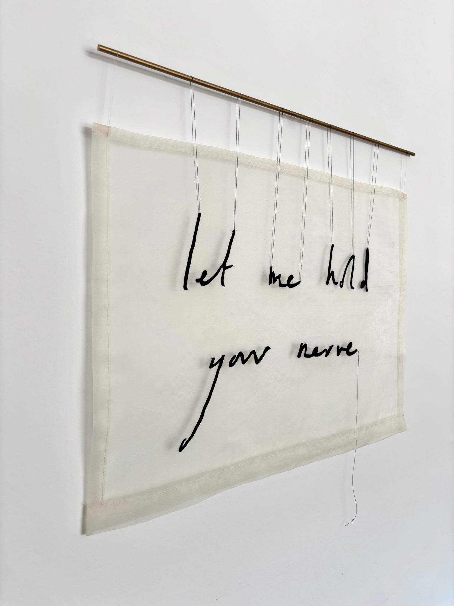 Textual art piece with 'Let me hold your nerve' on a white background